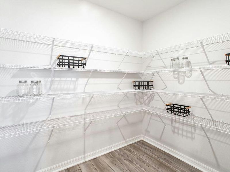 A walk-in pantry provides storage convenience - Serendipity by Highland Homes A walk-in pantry provides storage convenience - Serendipity by Highland Homes
