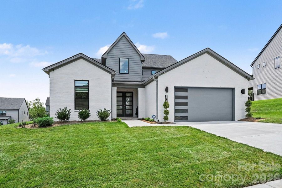 Front exterior of a new home in , Huntersville, NC, highlighting curb appeal (Image 22). Front exterior of a new home in , Huntersville, NC, highlighting curb appeal (Image 22).