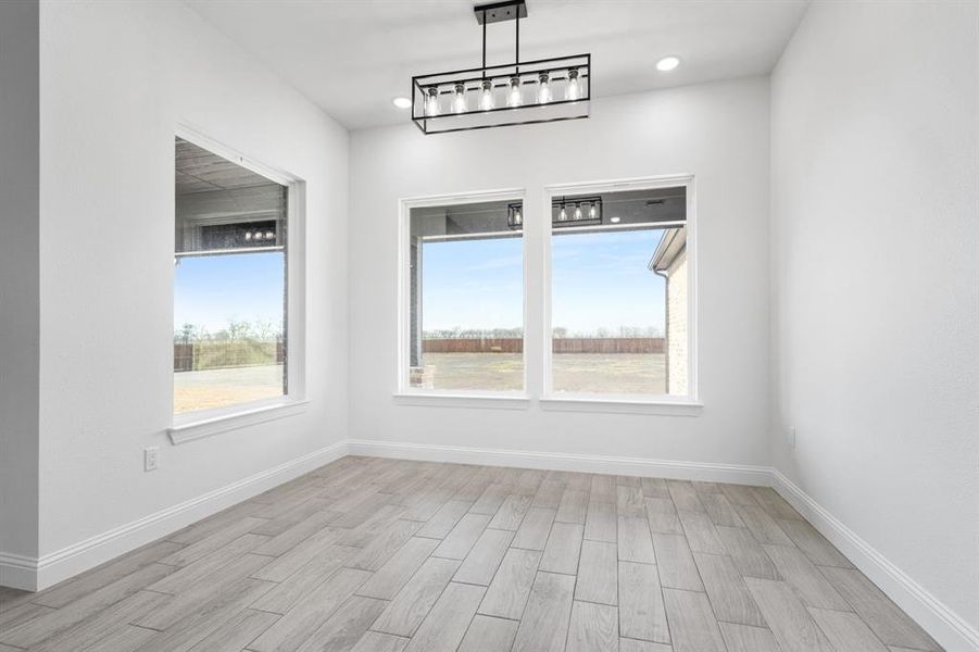 Spare room with light wood-type flooring