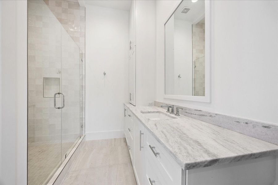 This secondary bathroom has a stand up glass shower and lots of storage! This secondary bathroom has a stand up glass shower and lots of storage!