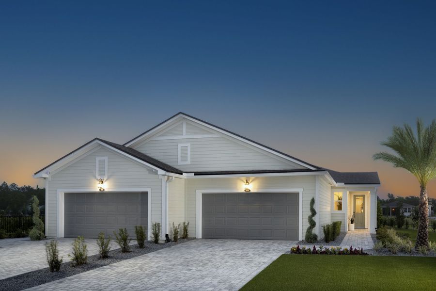 Front exterior of a new home in RiverTown - WaterSong, St. Johns, FL, highlighting curb appeal (Image 1).