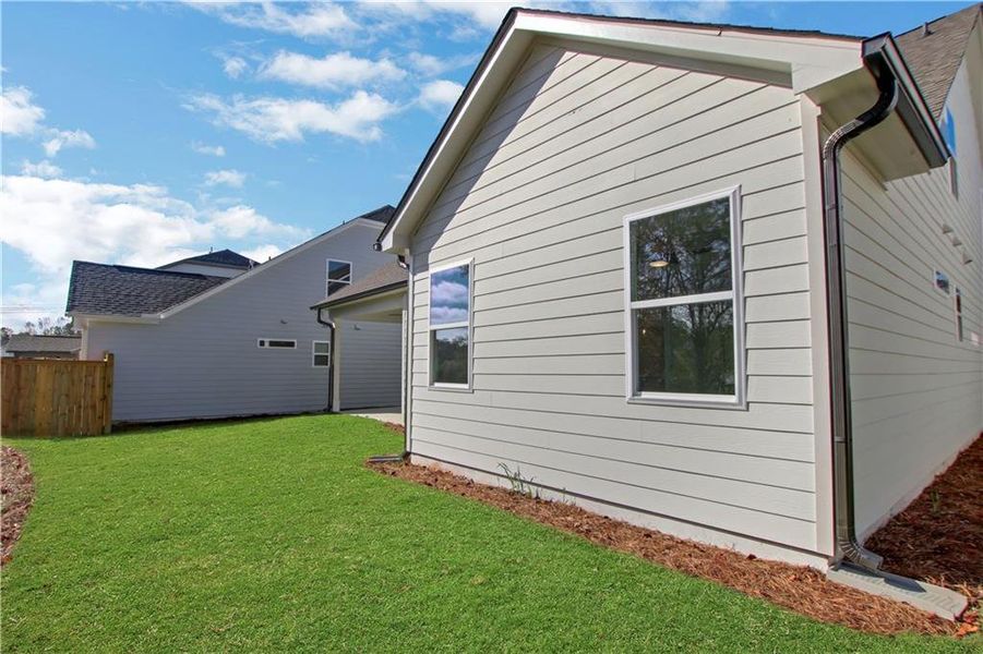 Exterior details and patio area of a home in Marble Tree, Ball Ground (Image 25).
