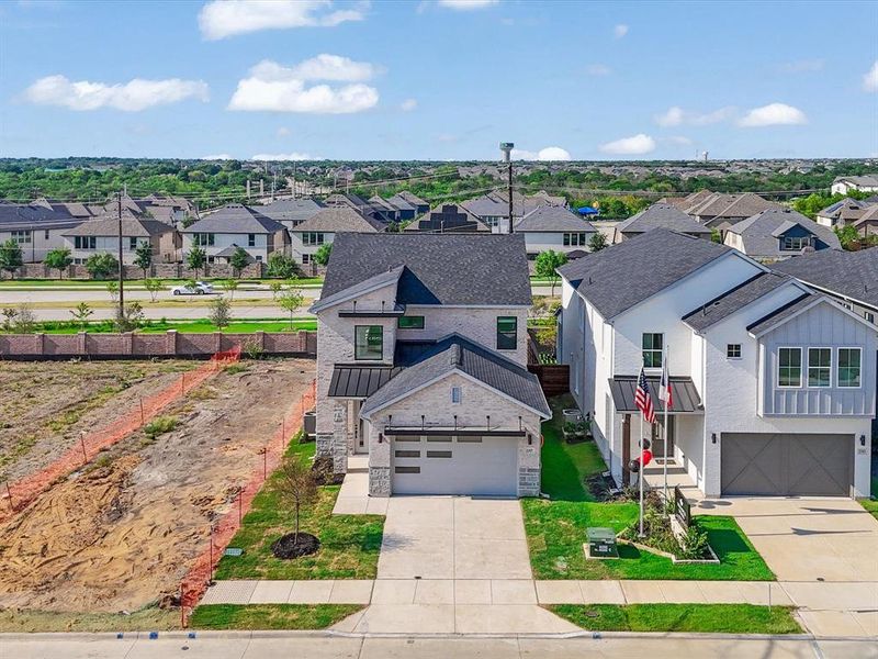 Front exterior of a new home in Royal Court, Little Elm, TX, highlighting curb appeal (Image 23).