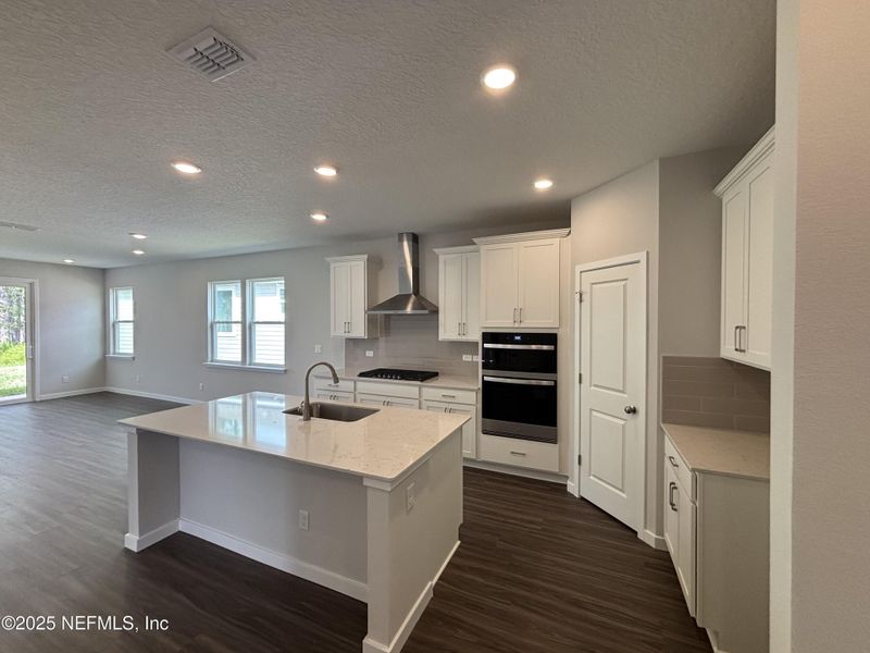 Furnished interior view inside a new home in The Magnolia Series at Reserve East, Flagler Beach (Image 9).