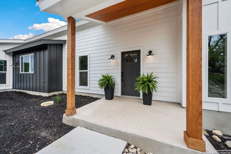Front exterior of a new home in , Canyon Lake, TX, highlighting curb appeal (Image 22). Front exterior of a new home in , Canyon Lake, TX, highlighting curb appeal (Image 22).