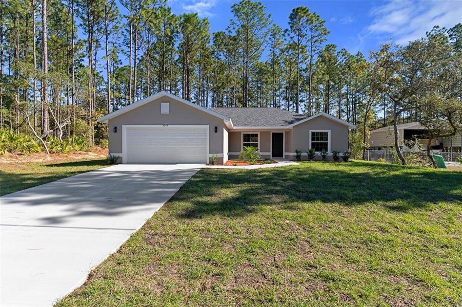 Front exterior of a new home in , Citrus Springs, FL, highlighting curb appeal (Image 30).