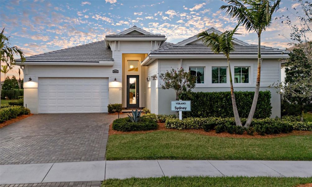Front exterior of a new home in PGA Village Verano, Port St. Lucie, FL, highlighting curb appeal (Image 20).
