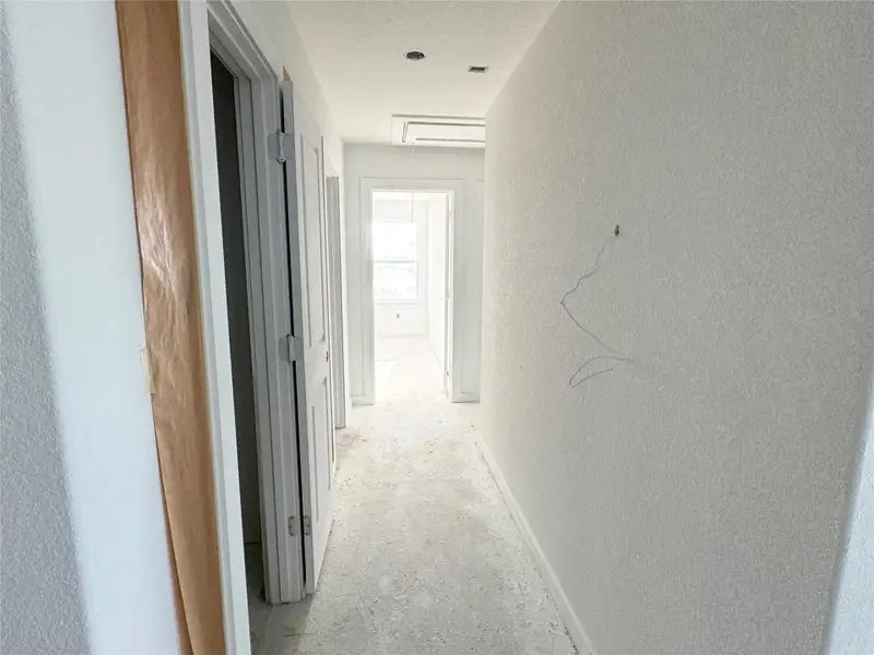 Hall with a textured wall and a textured ceiling Hall with a textured wall and a textured ceiling