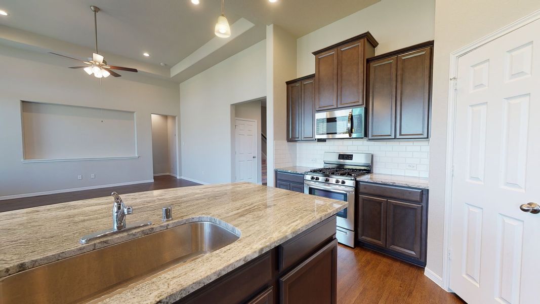 Representative furnished interior of a home built from the Floor Plan 3256 by Colina Homes in Grand Magnolia, Magnolia (Image 10).