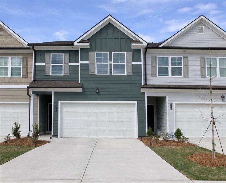 Front exterior of a new home in Rivershire Place, Villa Rica, GA, highlighting curb appeal (Image 1). Front exterior of a new home in Rivershire Place, Villa Rica, GA, highlighting curb appeal (Image 1).