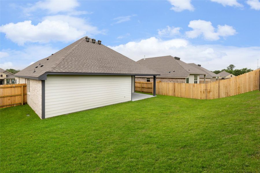 Exterior details and patio area of a home in Vintage Farms, Brenham (Image 24).