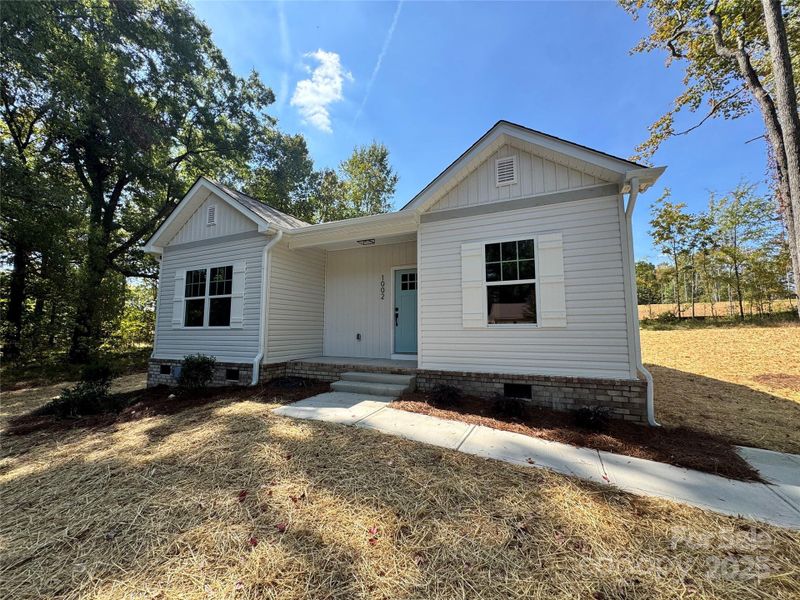 Front exterior of a new home in , Monroe, NC, highlighting curb appeal (Image 15).