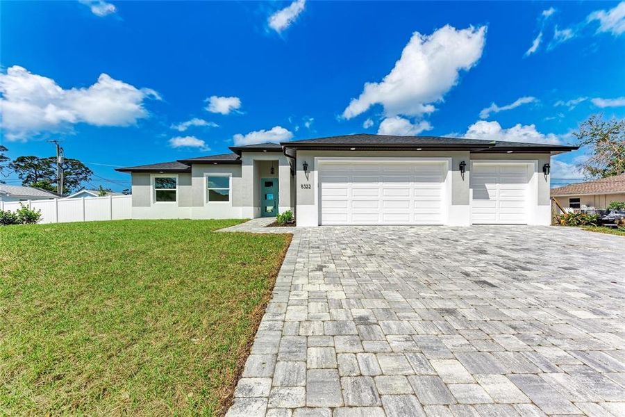 Front exterior of a new home in , Venice, FL, highlighting curb appeal (Image 22).