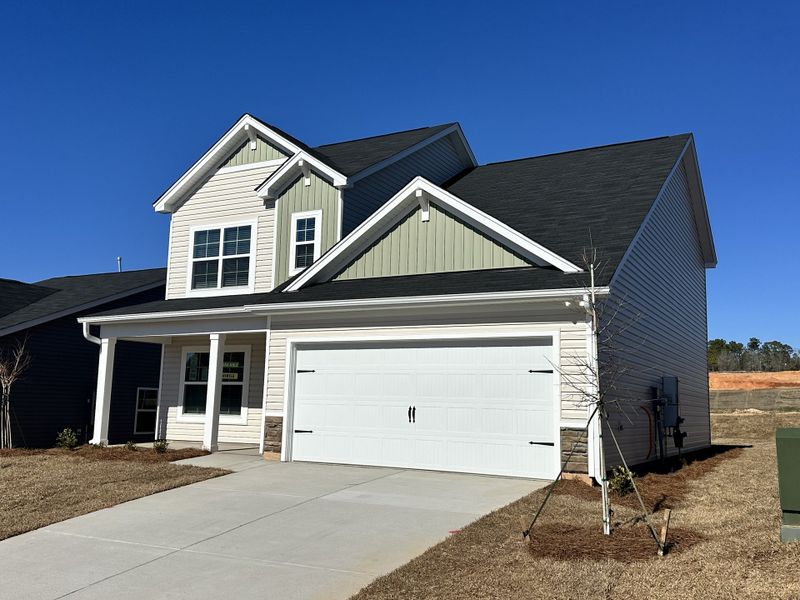 Front exterior of a new home in Canary Woods, Hopkins, SC, highlighting curb appeal (Image 21).