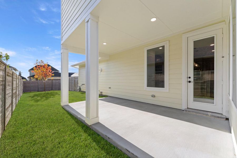 Exterior details and patio area of a home in Carriage Collection at Painted Tree, McKinney (Image 3).
