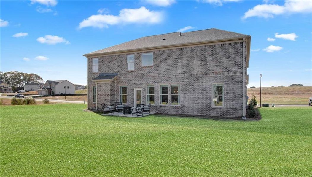 Front exterior of a new home in Adagio, Dacula, GA, highlighting curb appeal (Image 18).