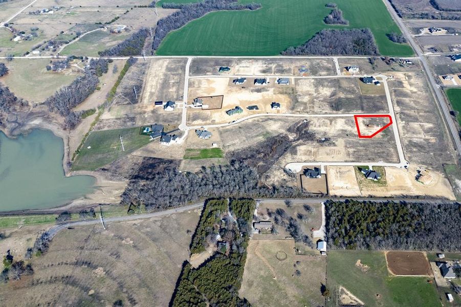 Aerial overview of property's location with property boundaries highlighted and rural landscape Aerial overview of property's location with property boundaries highlighted and rural landscape