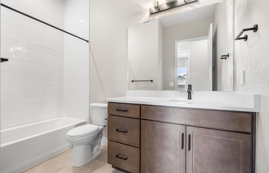 Furnished interior view inside a new home in Hilltop at Inspiration, Aurora (Image 11).