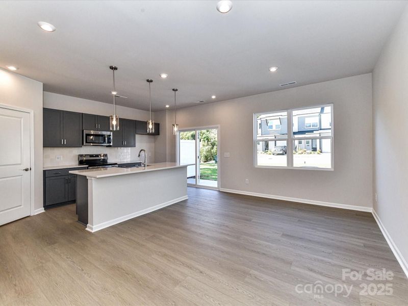 Dining and Kitchen Sitting Conveniently Side by Side.