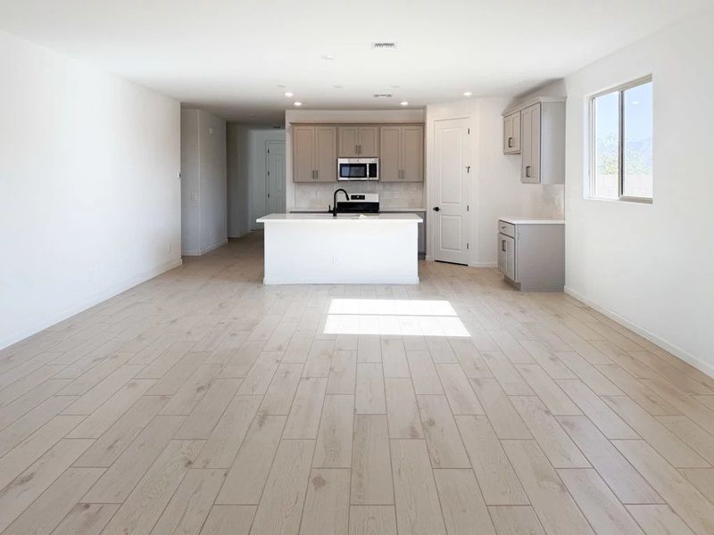 Great room, dining and kitchen Great room, dining and kitchen
