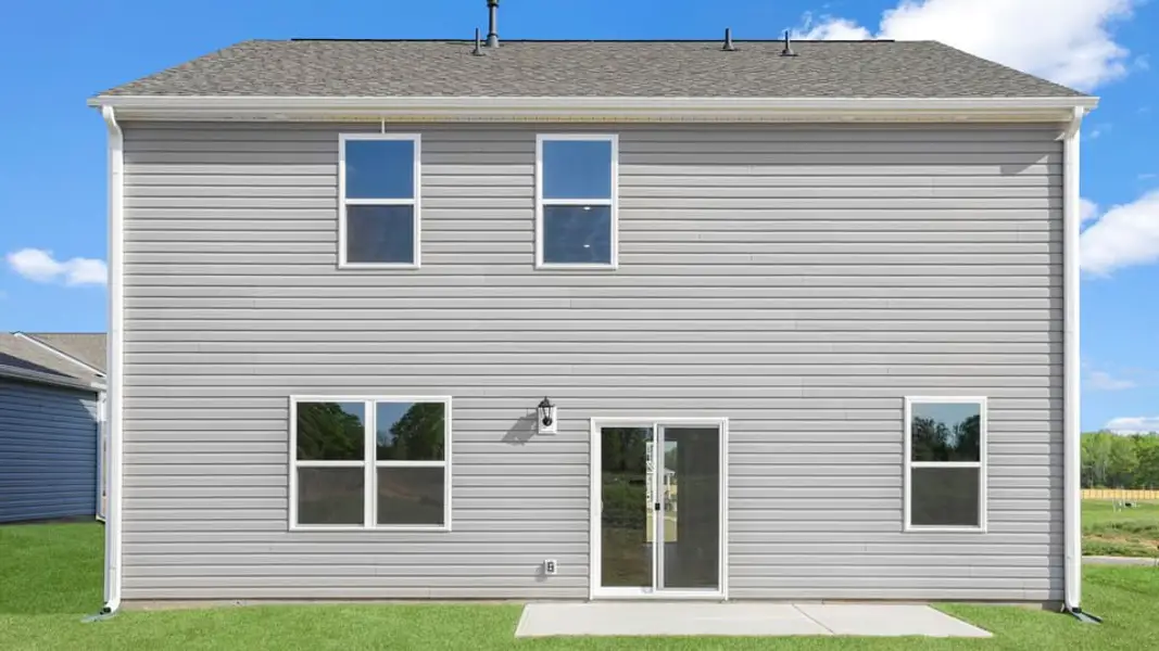 Exterior details and patio area of a home in Durbin Meadows Traditions, Fountain Inn (Image 3).