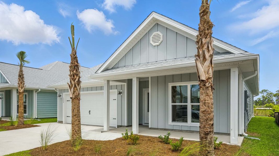 Front exterior of a new home in WindMark Beach, Port Saint Joe, FL, highlighting curb appeal (Image 17). Front exterior of a new home in WindMark Beach, Port Saint Joe, FL, highlighting curb appeal (Image 17).