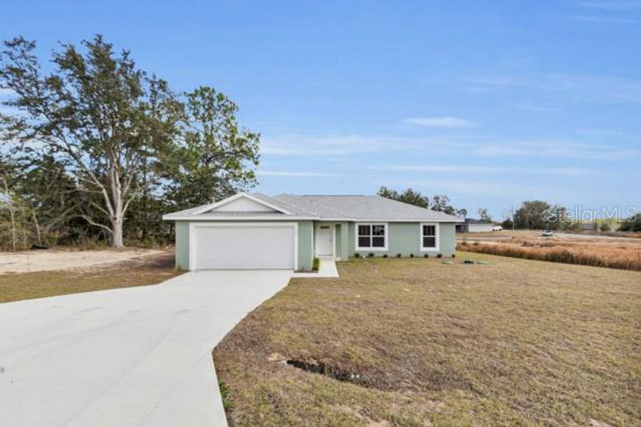 Front exterior of a new home in , Ocala, FL, highlighting curb appeal (Image 19).