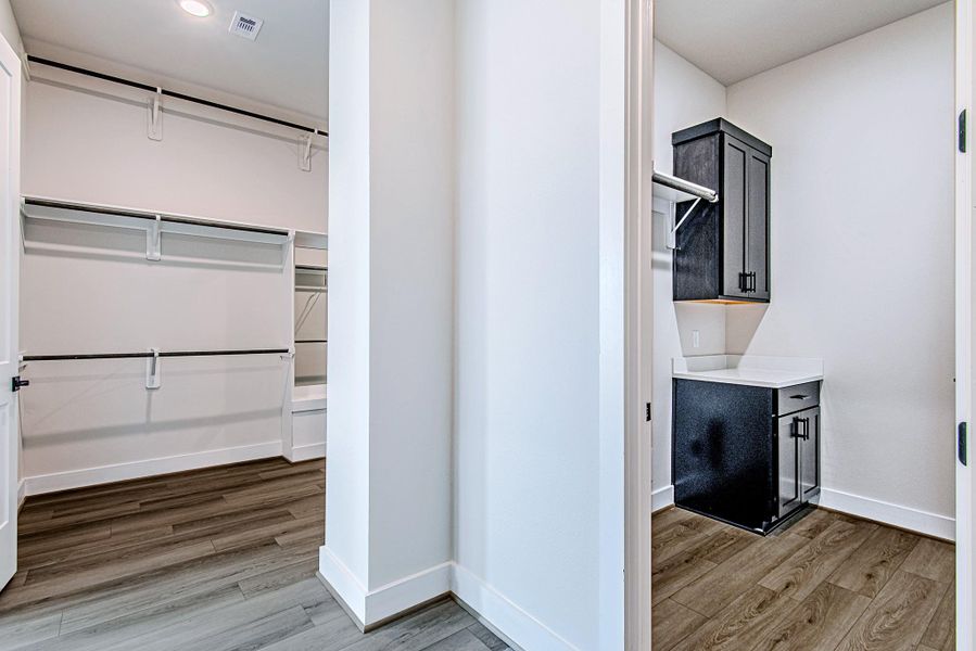 Another view of the spacious walk-in closet and custom shelving