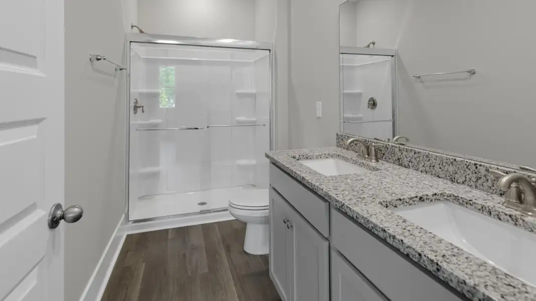 Furnished interior view inside a new home in The Retreat at Indigo Preserve Townhomes, Leland (Image 9).