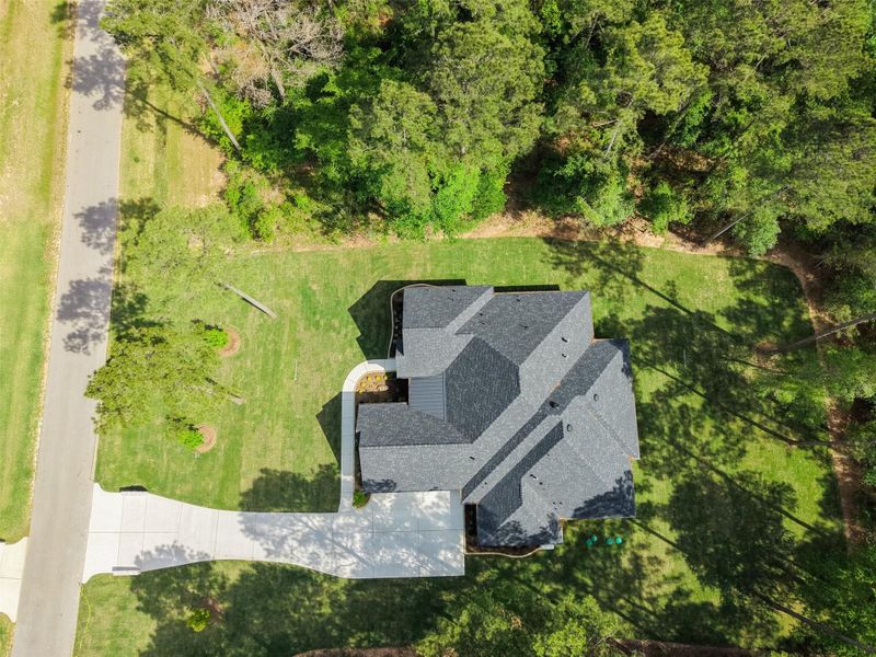 Front exterior of a new home in , Plantersville, TX, highlighting curb appeal (Image 22).