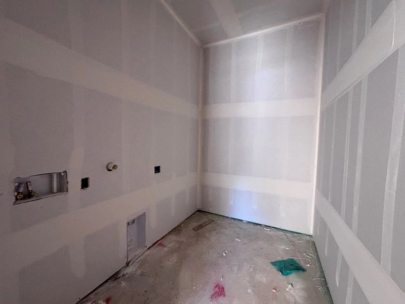 In-progress construction of a new home in The Colony 50s, Bastrop, TX (Image 9).