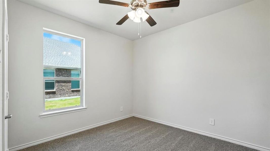 Room with neutral wall paint and gray carpet flooring Room with neutral wall paint and gray carpet flooring