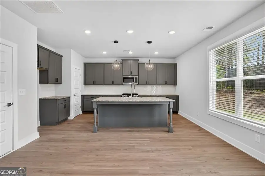 Furnished interior view inside a new home in The Fairways at Mirror Lake, Villa Rica (Image 3).