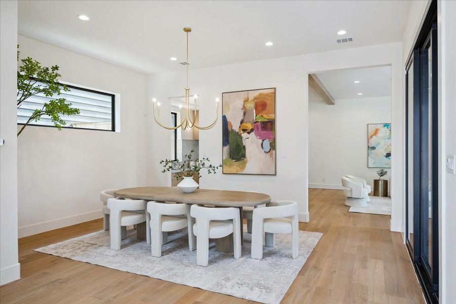 Dining area – features a designer lighting fixture and recessed lighting. Dining area – features a designer lighting fixture and recessed lighting.