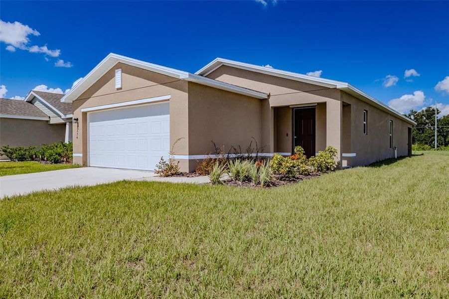 Front exterior of a new home in , Eagle Lake, FL, highlighting curb appeal (Image 22).