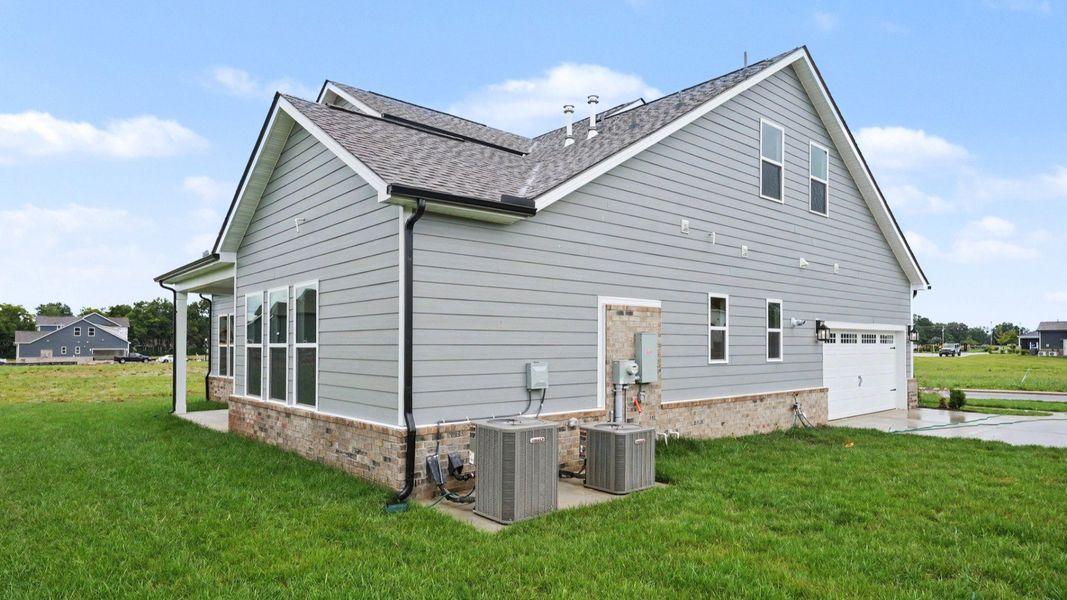 Rear exterior with side view of side-load garage
