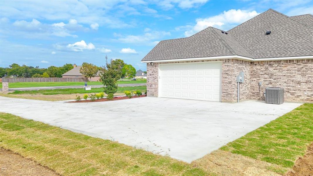Front exterior of a new home in , Corsicana, TX, highlighting curb appeal (Image 19). Front exterior of a new home in , Corsicana, TX, highlighting curb appeal (Image 19).