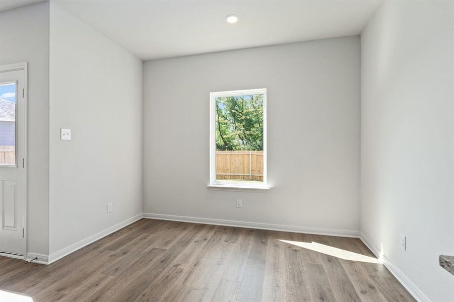 Empty room featuring wood finished floors