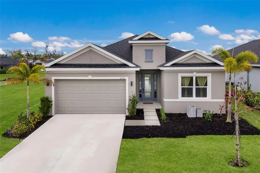 Front exterior of a new home in , Parrish, FL, highlighting curb appeal (Image 2). Front exterior of a new home in , Parrish, FL, highlighting curb appeal (Image 2).