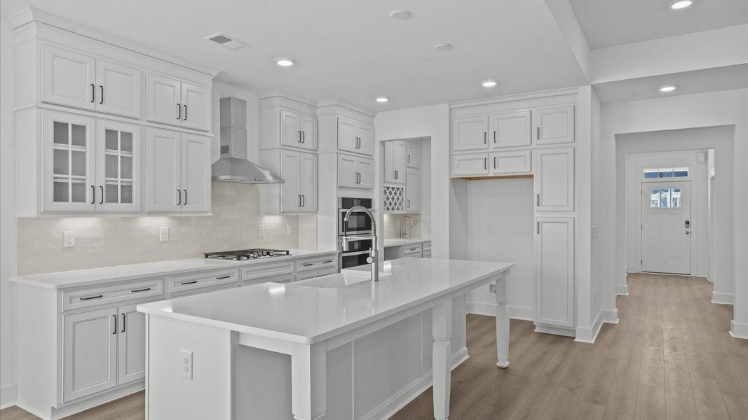 Tasteful design meets functional luxury in this kitchen with a 9-foot island