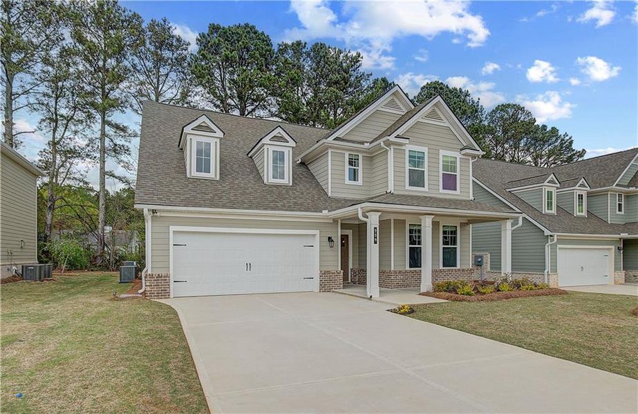 Front exterior of a new home in Cooper Park, McDonough, GA, highlighting curb appeal (Image 16).