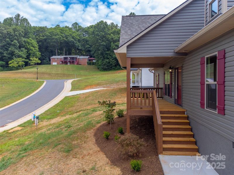 Front exterior of a new home in , Franklin, NC, highlighting curb appeal (Image 19).