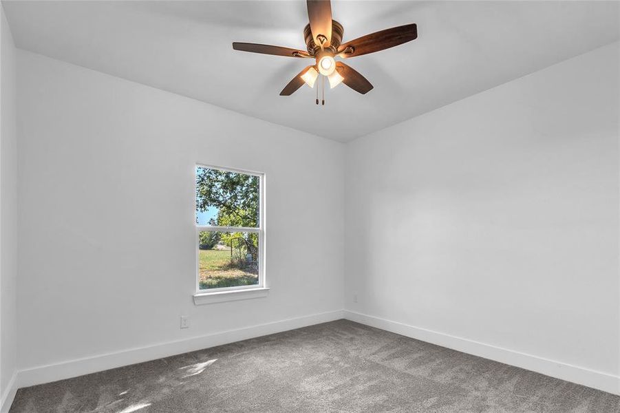 Carpeted 3rd Bedroom with lighted ceiling fan Carpeted 3rd Bedroom with lighted ceiling fan