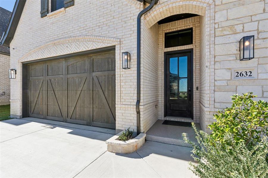 Property entrance with a garage