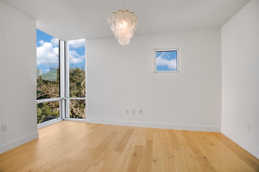 Master BR w/custom closets & corner reading alcove w/bookshelves. Bed wall w/clerestory window.