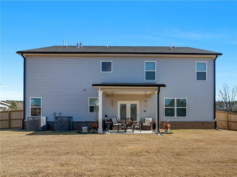 Exterior details and patio area of a home in Bridle Creek, Locust Grove (Image 21).