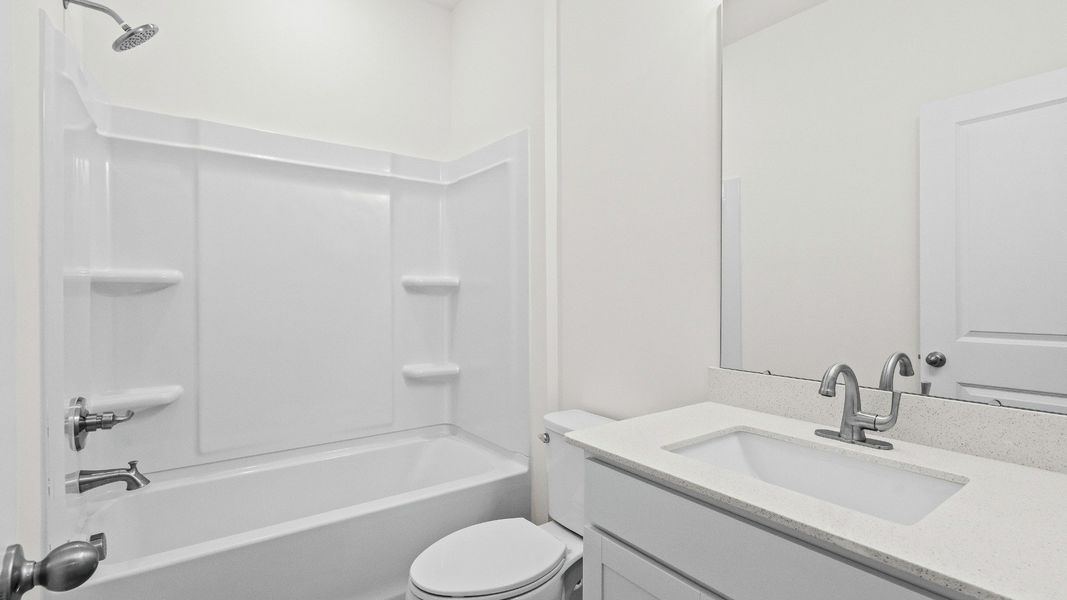 A well-appointed secondary bath supporting flexible family living A well-appointed secondary bath supporting flexible family living