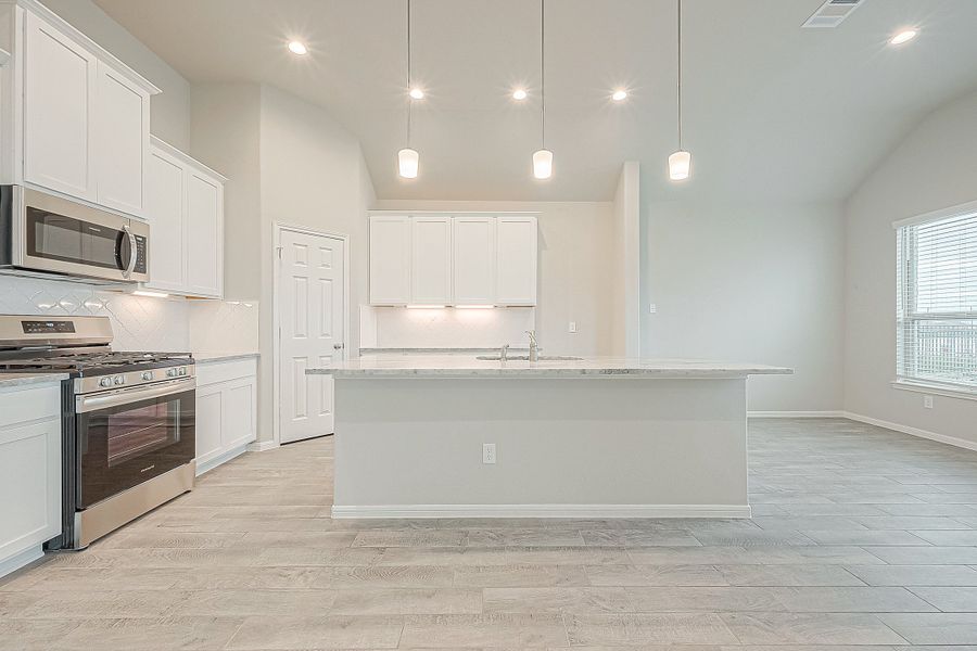 Representative furnished interior of a home built from the Floor Plan 2050 by Colina Homes in Grand Magnolia, Magnolia (Image 12).