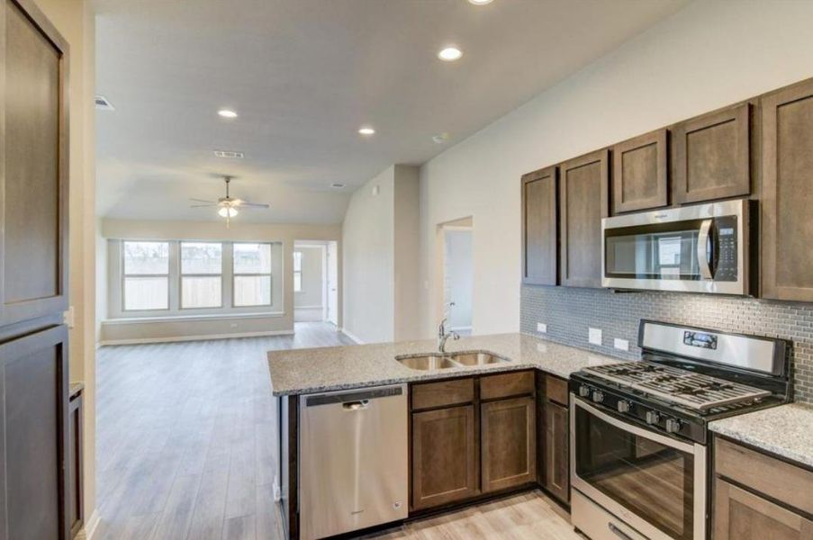 Furnished interior view inside a new home in Crosswinds, Kyle (Image 7).
