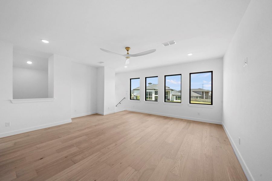 Upstairs living space offering an ideal setting for relaxing, entertaining, or family gatherings